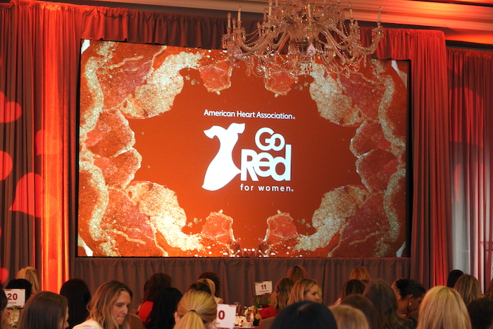 American Heart Association Go Red for Women logo displayed on screen during event